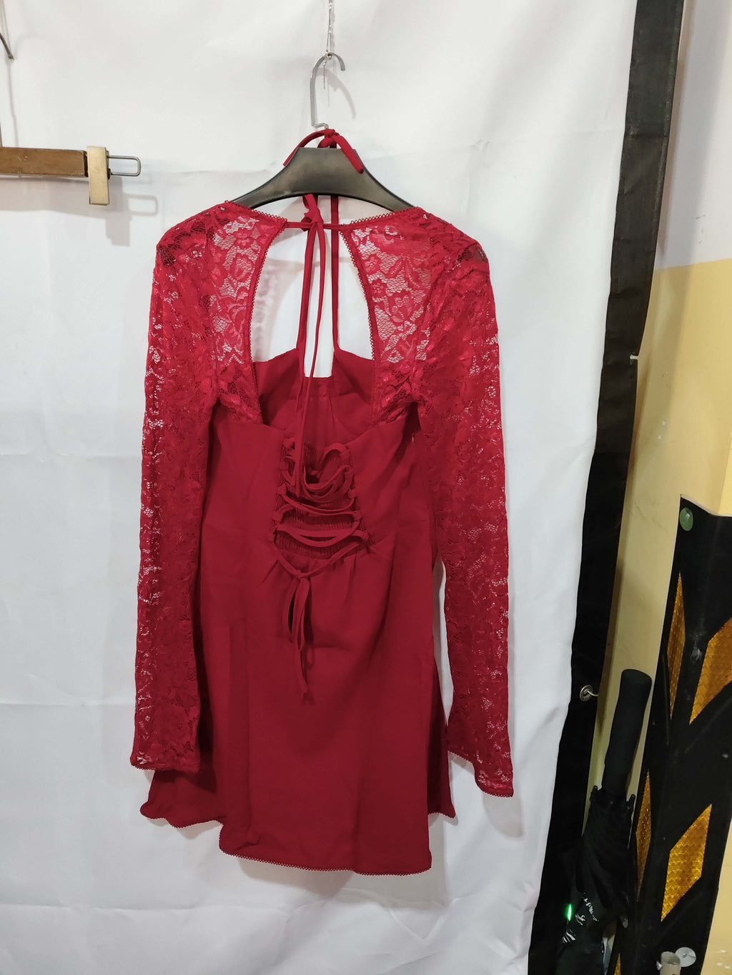 Back view of a red Y2K lace bodycon corset top with long sleeves, designed for going out and nightlife.