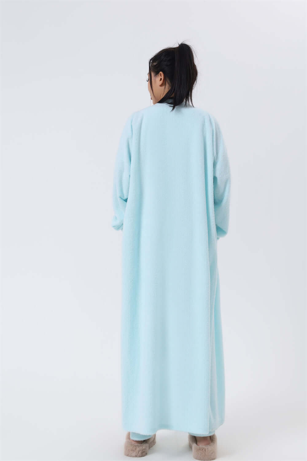 Women wearing a soft, cozy loungewear set, showcasing the back view of the turquoise 3-piece pajama set.