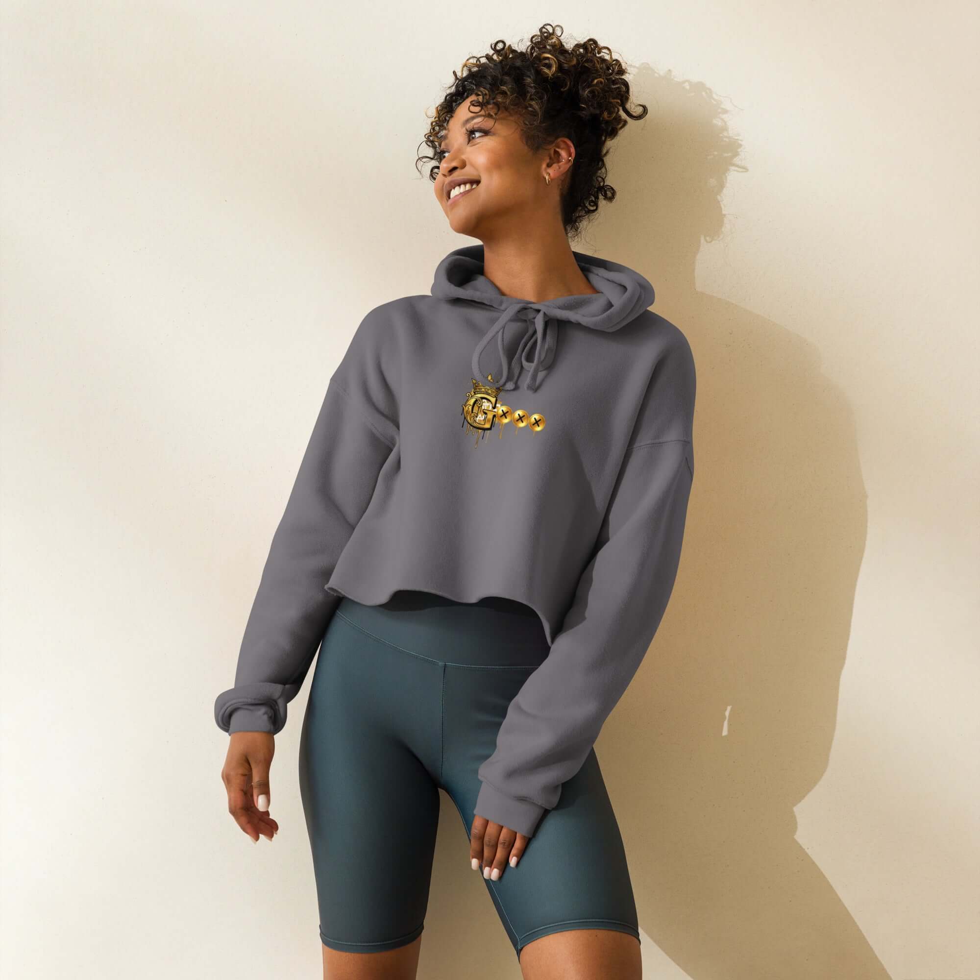 Trendy crop hoodie in gray with dropped shoulder design and stylish drawstrings, perfect for casual wear.